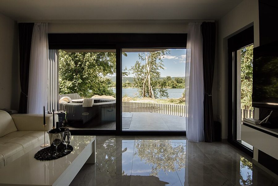 Bright living room with a lakeside view